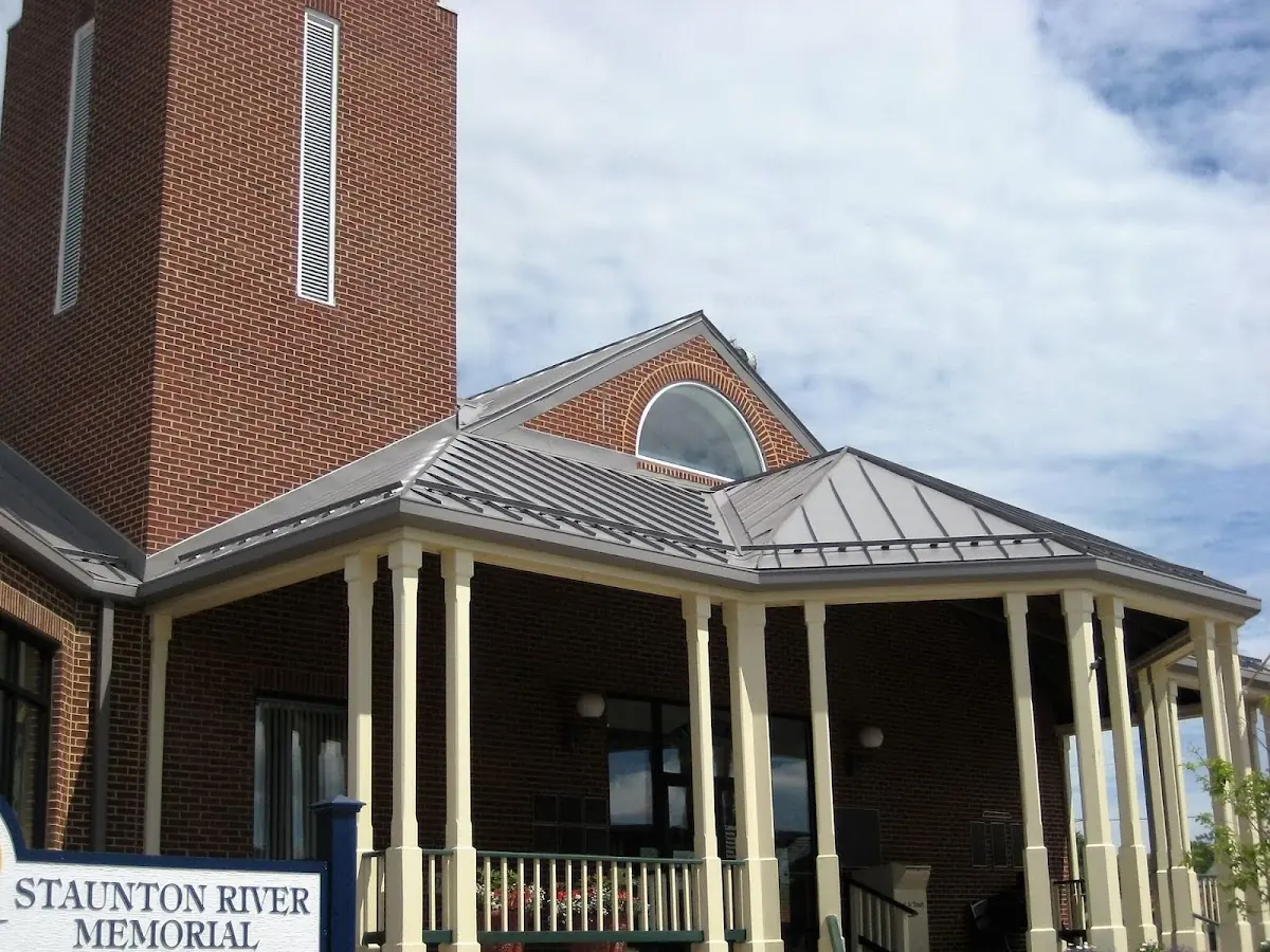 Skilled roofing craftsmen working on a residential roof in McIntyre